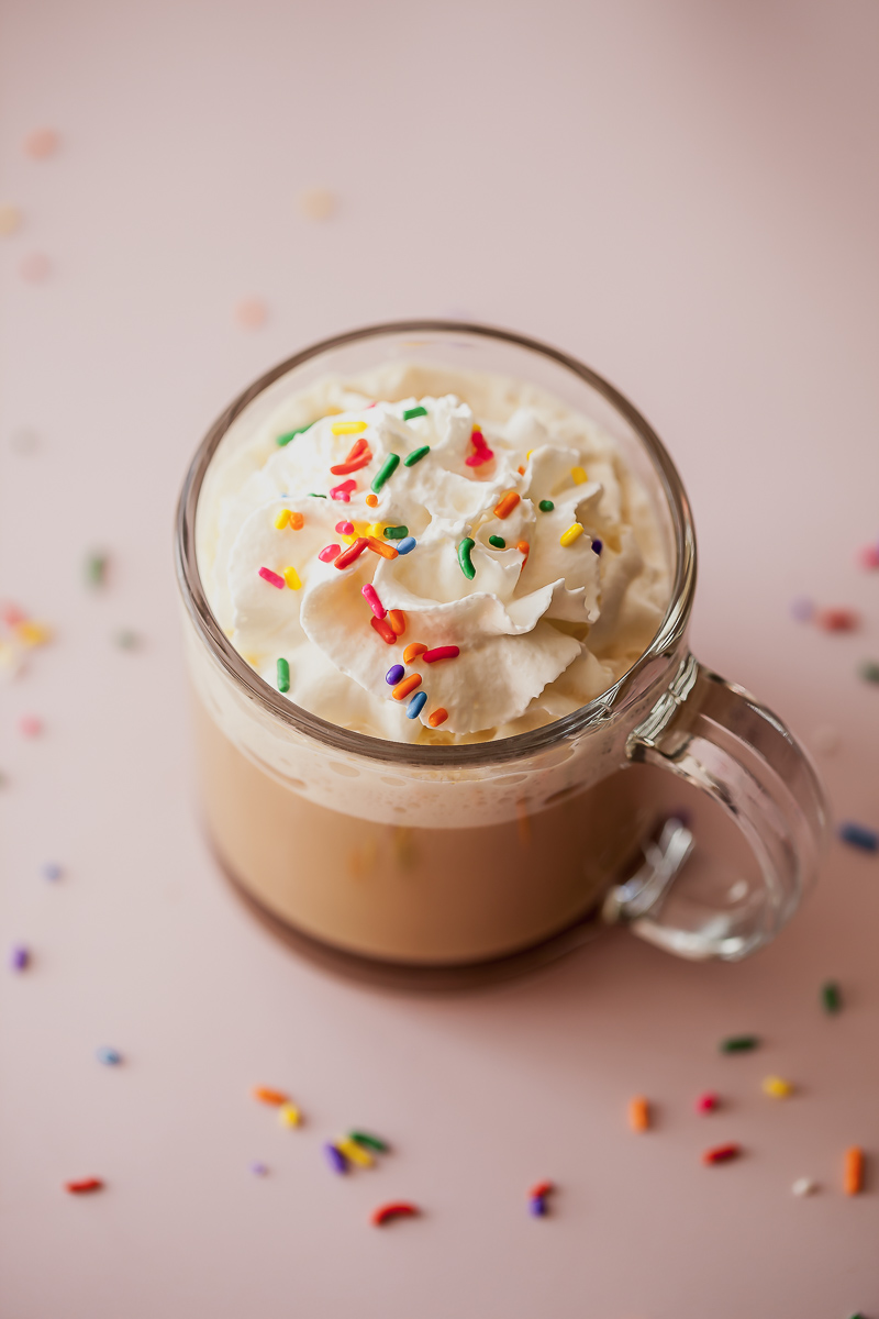 sugar cookie latte with whipped cream and sprinkles